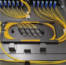 Internal view of a 400G coherent transceiver showing a fiber array connected to the photonic IC
