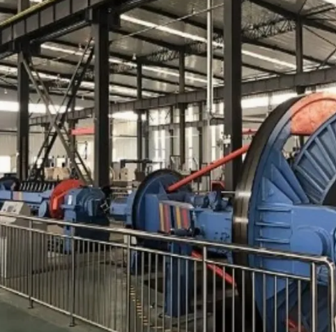 Dual coating applicators applying protective layers immediately after fiber drawing with UV curing between stations