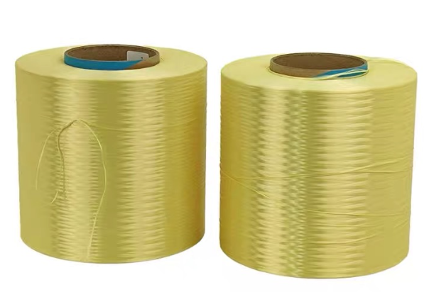 Optical fiber cable manufacturing line showing para-aramid yarn being applied as strength member around fiber core