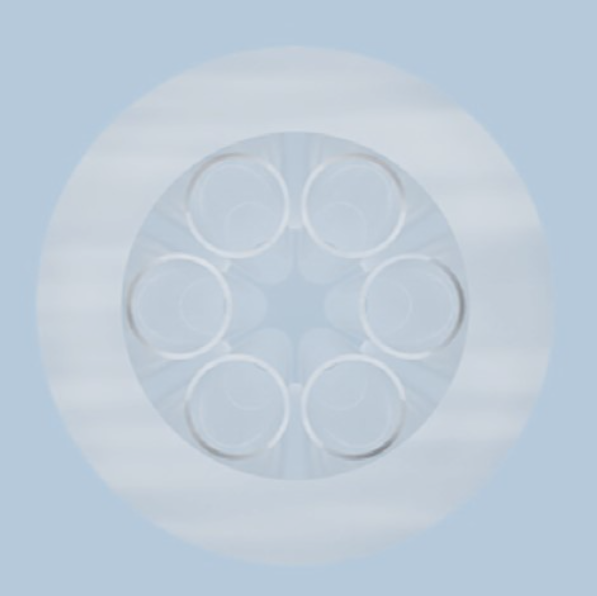 Cross-section of assembled glass capillaries arranged in hexagonal pattern around central hollow core for fiber drawing